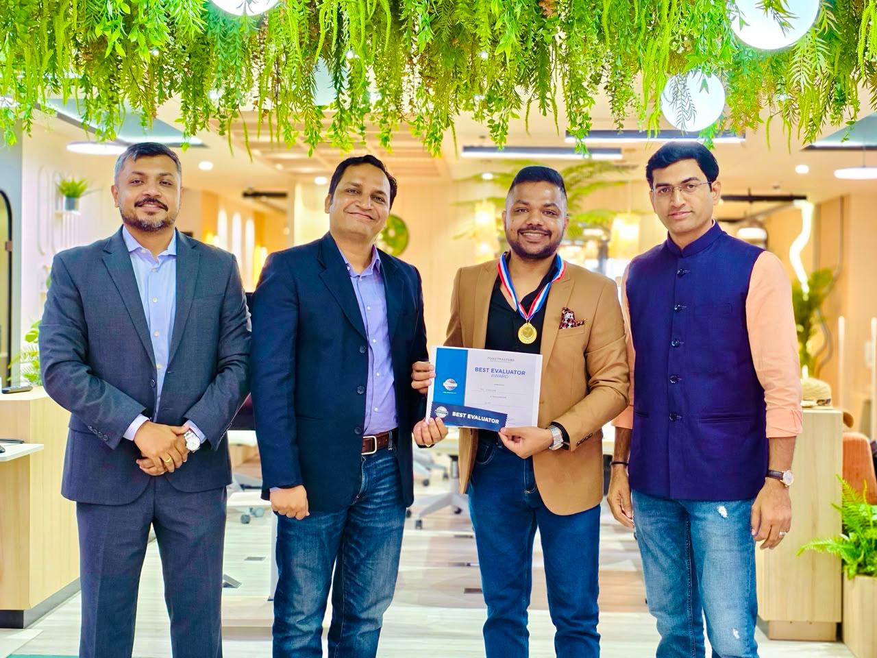 Ekansh Agrawal receiving the Best Evaluator award at Toastmasters